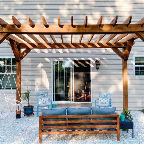 metal pergola in front of house|wooden pergola attached to house.